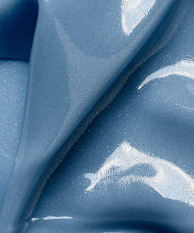 111SKIN close-up of blue gel texture illustrating concentrated serum and cooling feel
