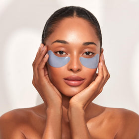 111SKIN model applying patch under eye demonstrating immediate de-puffing comfort