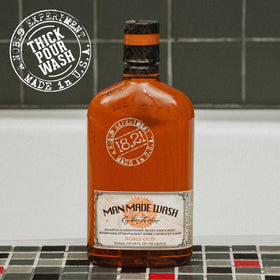 18.21 Man Made bottle styled on bathroom shelf suggesting premium routine benefit