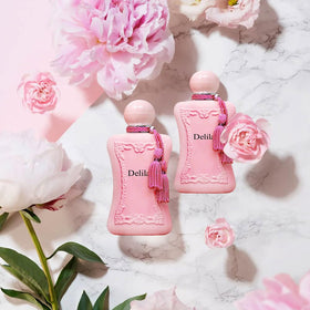 A CENTER Delilah bottle held in hand to show 100ml size and travel readiness