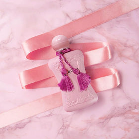 A CENTER Delilah mist over skin illustrating fresh application and lasting aroma