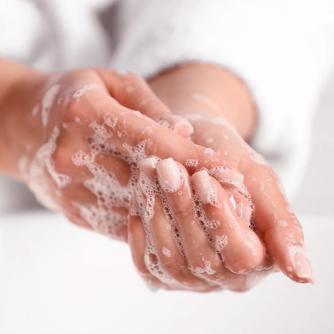 A LA MAISON hand washing at sink showing daily use and fresh scent benefit
