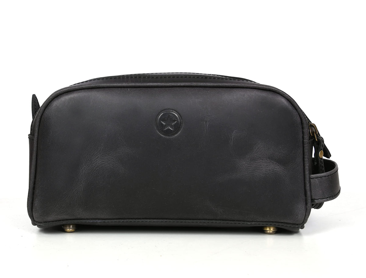 AARON LEATHER GOODS next to toiletries showing king-size capacity for packing
