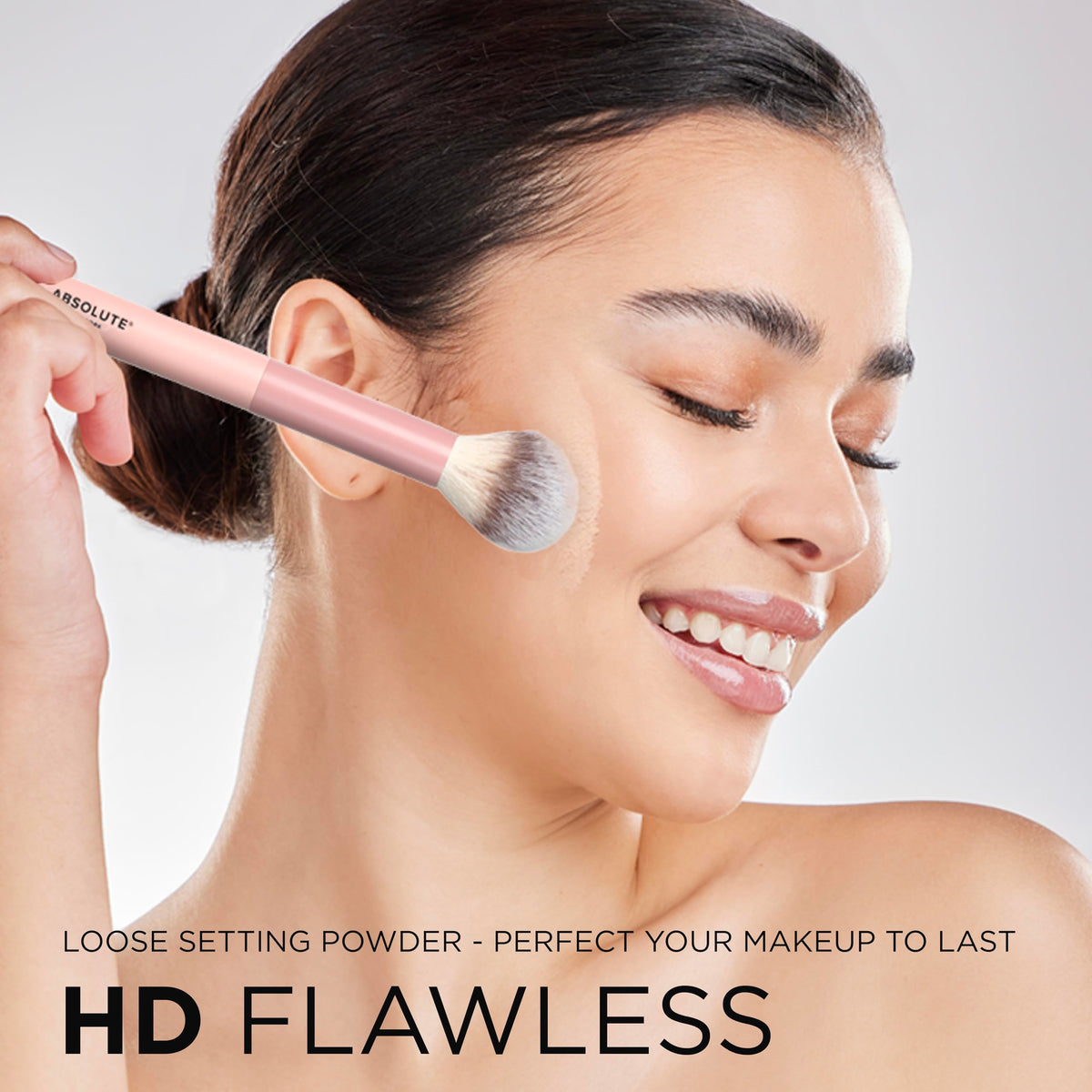 Absolute New York powder in hand to show compact size and travel-friendly convenience
