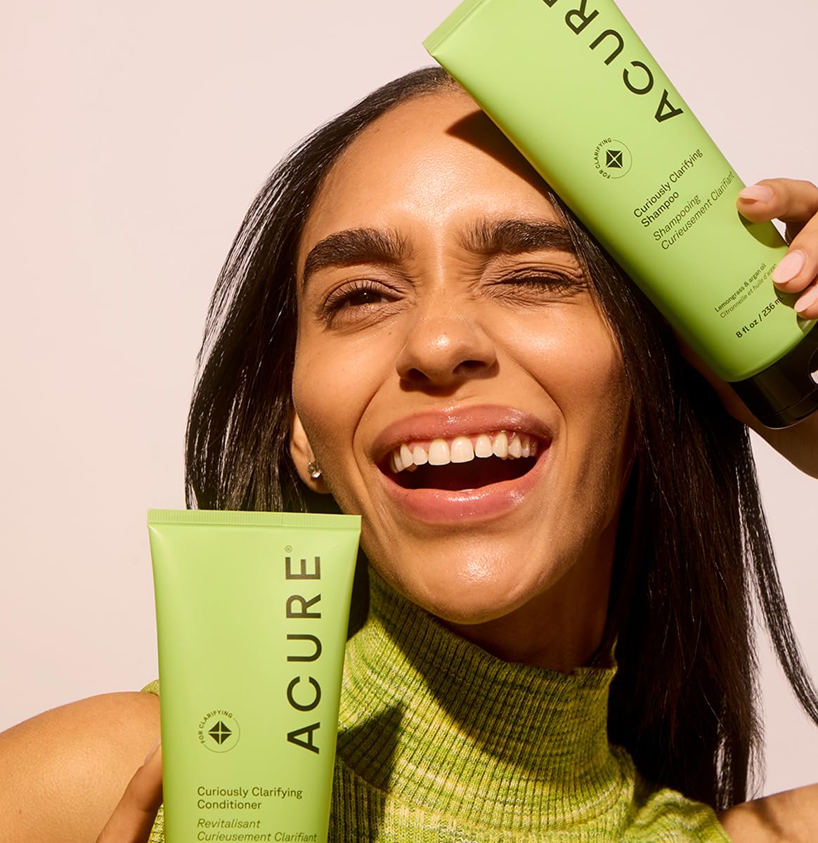 Acure conditioner being applied in shower for refreshed, clarified hair