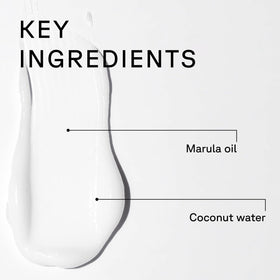Acure conditioner being applied to hair in hand for easier detangling