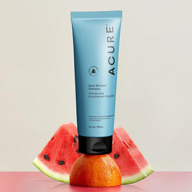 Acure watermelon and blood orange ingredients staged to highlight natural extracts