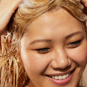 Acure in-shower application on wet hair for smoother styling
