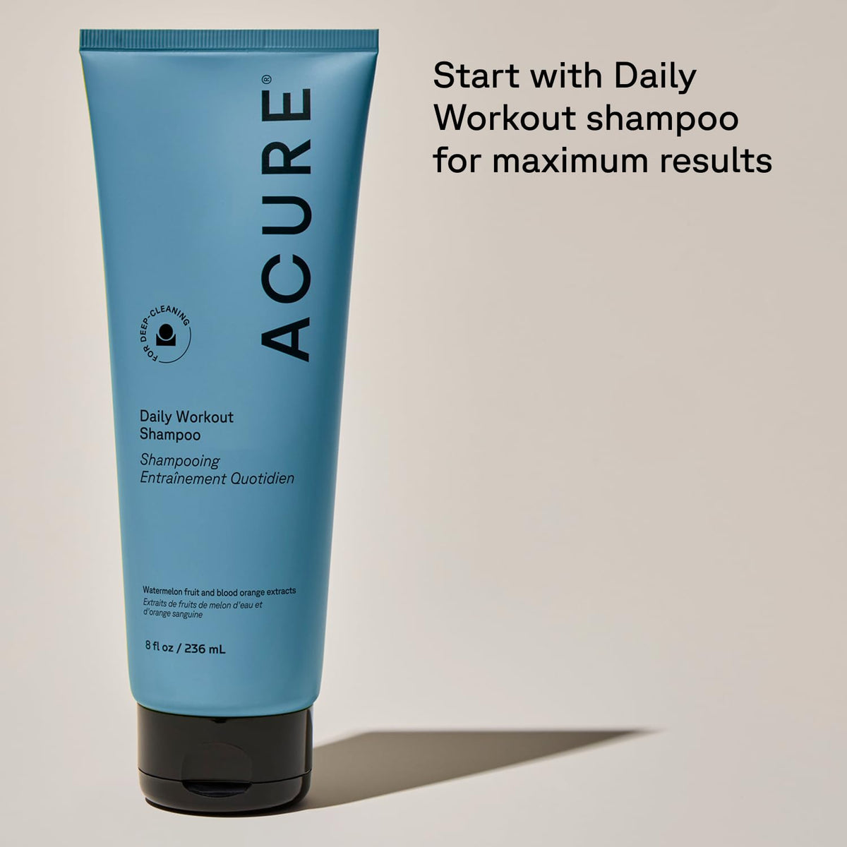 Acure 8 fl oz bottle held in hand showing size and travel-friendly benefit