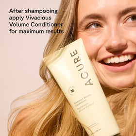 Acure shampoo in-hand during shower showing effortless rinse-out benefit