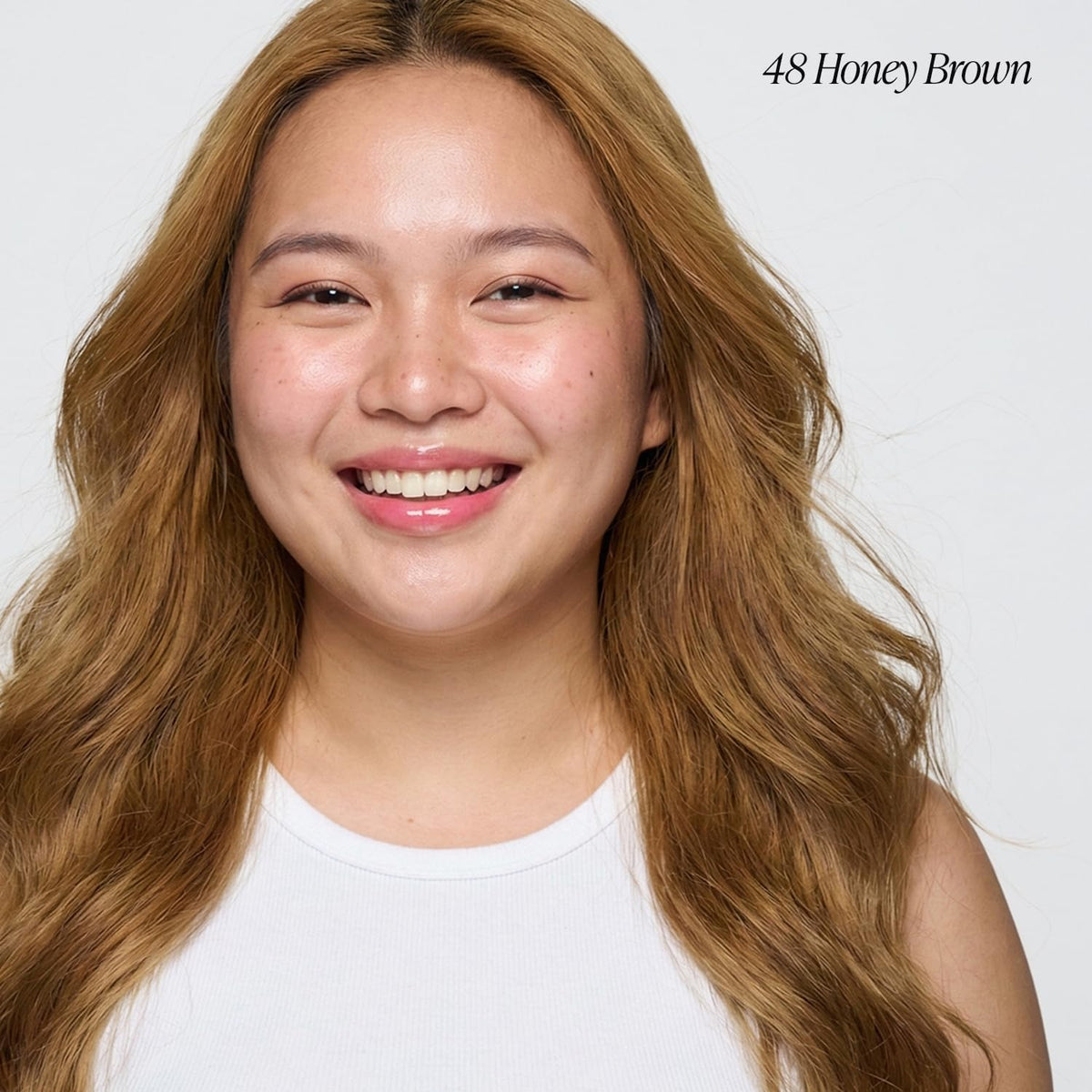 Close-up of Adore Honey Brown dye texture showing creamy consistency and rich pigment benefit