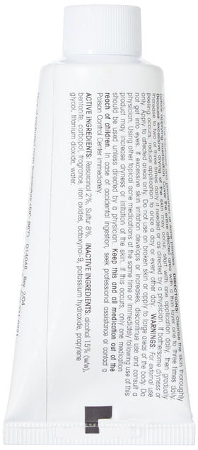 Adult Acnomel cream tinted texture on fingertip, demonstrates blendable coverage benefit