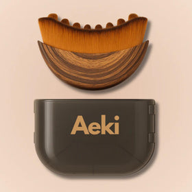 AEKI face brush front view showing compact ergonomic design and easy grip