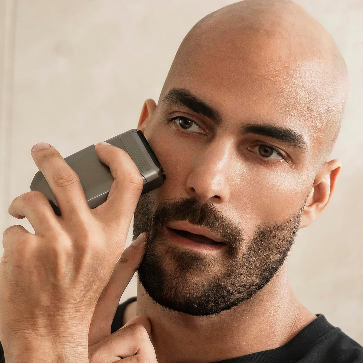 Aesfee shaver used in shower showing waterproof wet shave convenience