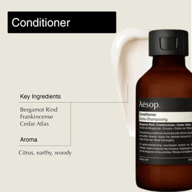 Conditioner pouring from Aesop tube showing creamy slip for easier detangling