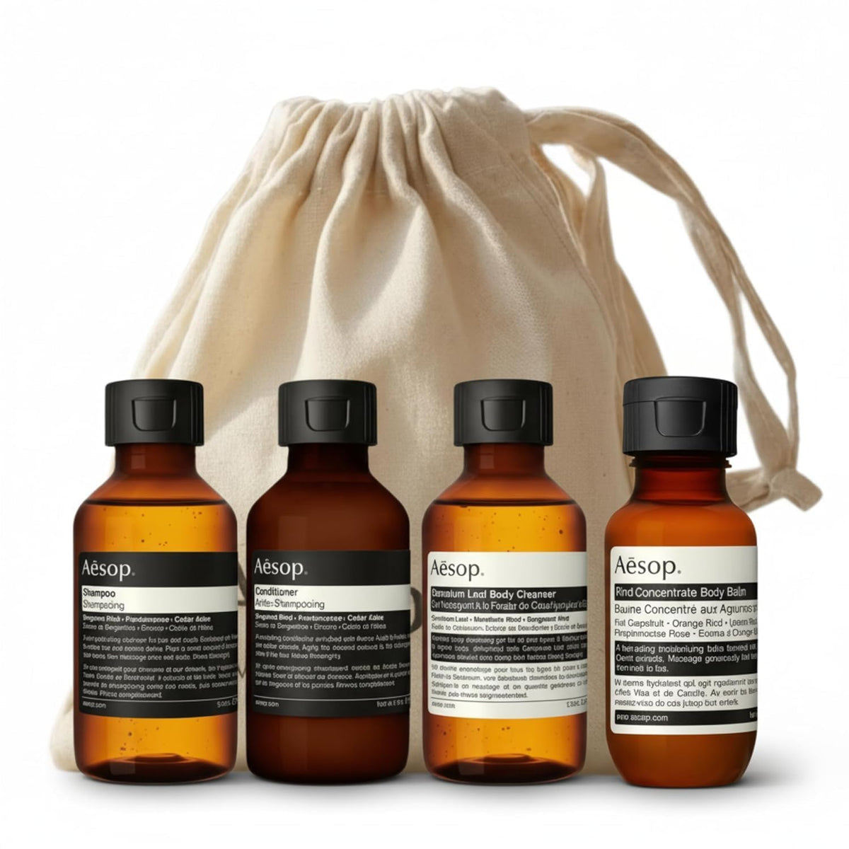 Aesop Arrival front view showing four travel-sized tubes and canvas bag for easy packing