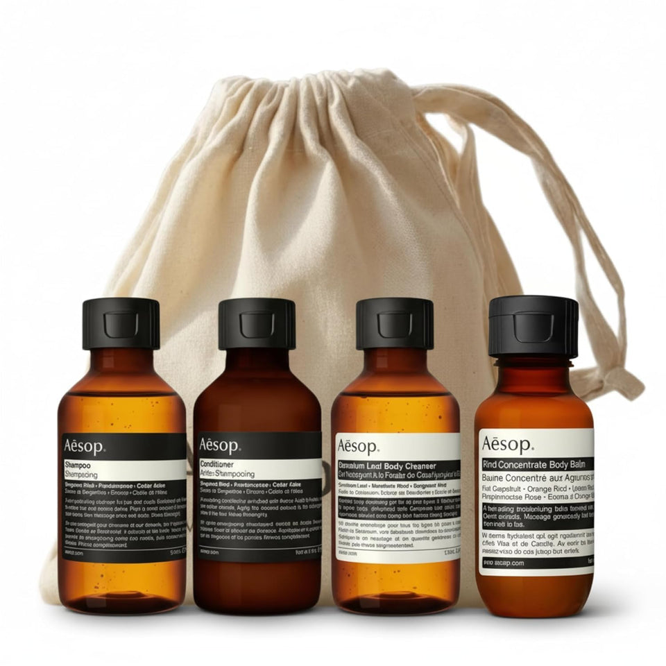 Aesop Arrival front view showing four travel-sized tubes and canvas bag for easy packing