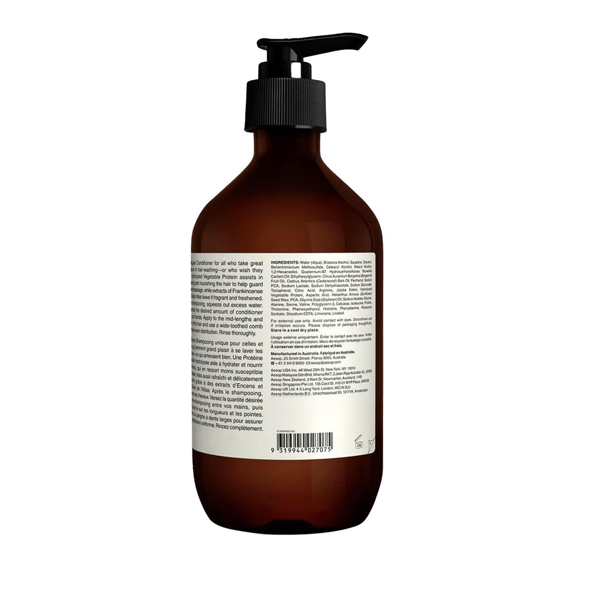 Aesop conditioner placed on bathroom shelf with plants, evokes refined grooming ritual