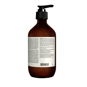 Aesop conditioner placed on bathroom shelf with plants, evokes refined grooming ritual