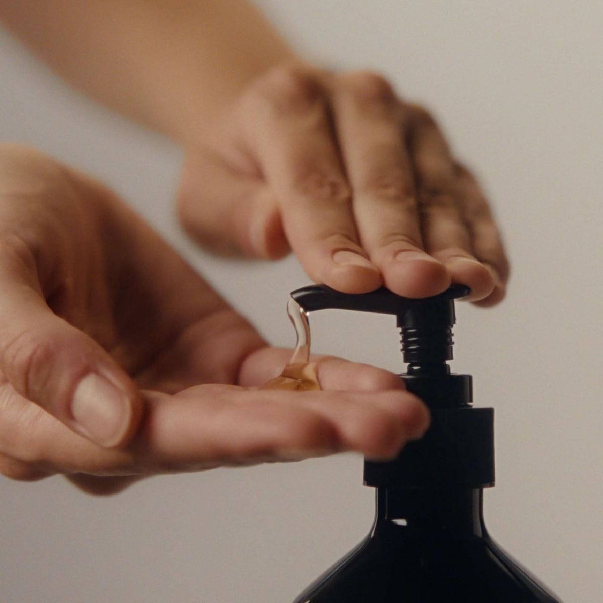 Aesop hand wash lather on palm showing foaming effectiveness and thorough cleansing