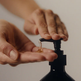 Aesop hand wash lather on palm showing foaming effectiveness and thorough cleansing