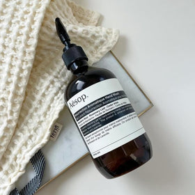 Aesop hand wash in bathroom lifestyle scene creating refined, welcoming atmosphere