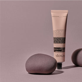 Aesop tube in hand demonstrating travel-size portability and scale