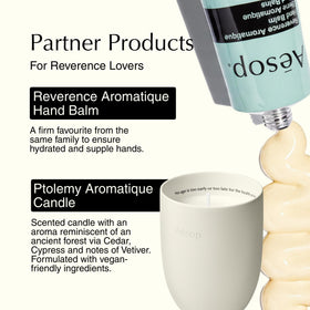 Aesop Reverence 500mL bottle beside hand for scale, demonstrating generous size and value