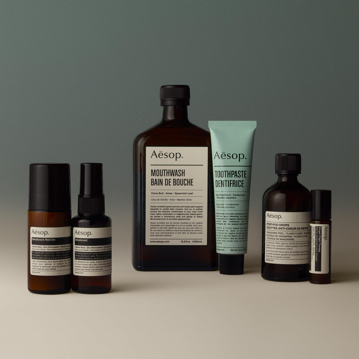 Aesop roll-on next to a coin for size comparison emphasizing travel-friendly 1.6 oz