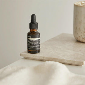 Close-up Aesop label listing botanical oils for visible ingredient transparency