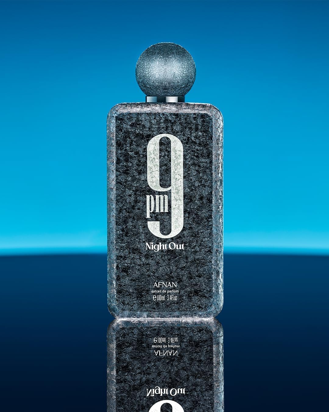 Afnan bottle on wood table in evening setting conveying warm, social vibe