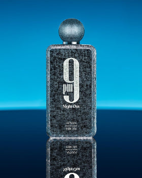 Afnan bottle on wood table in evening setting conveying warm, social vibe