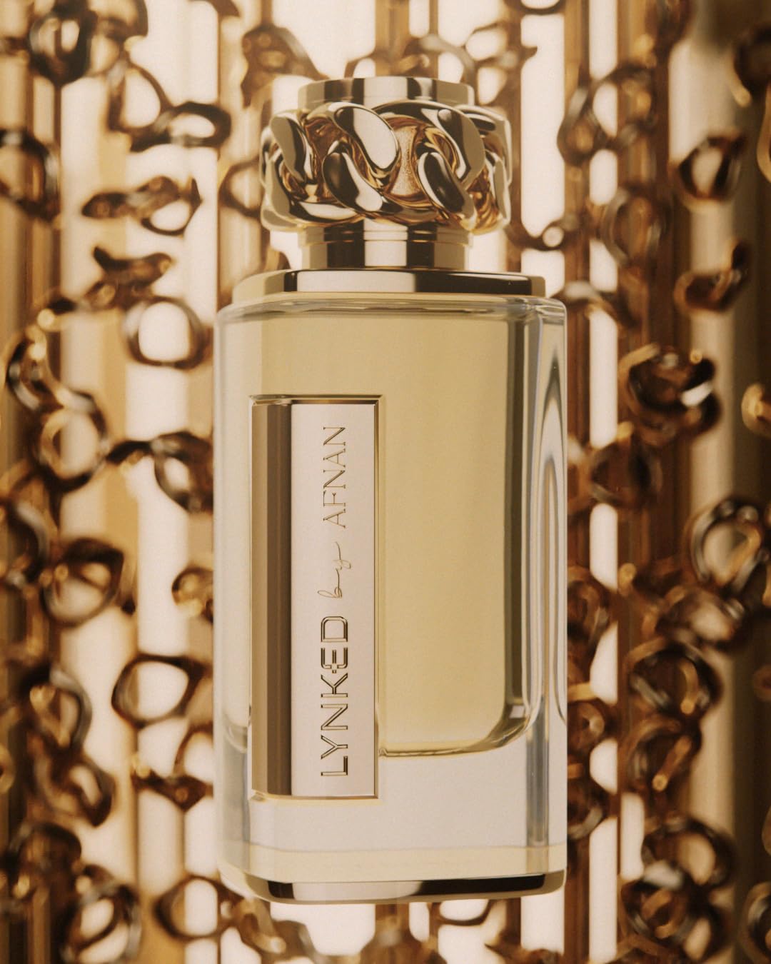 Afnan Lynked Forever Gold flatlay with mandarin and flowers showing scent ingredient story
