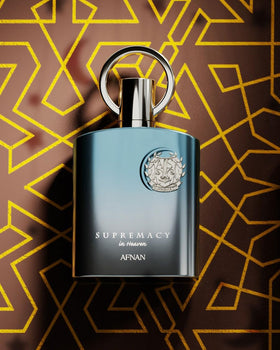 Afnan bottle in hand for scale, illustrating 3.4 fl. oz practical size