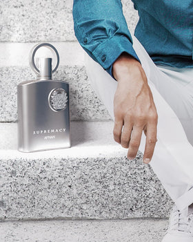 Afnan bottle in hand demonstrating 3.4 fl oz size and portability