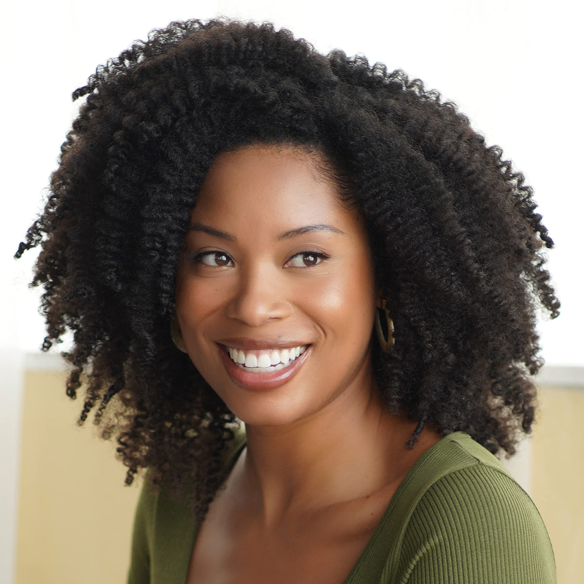 African Pride in bathroom routine shot showing pre-poo step for healthier hair