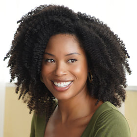 African Pride in bathroom routine shot showing pre-poo step for healthier hair