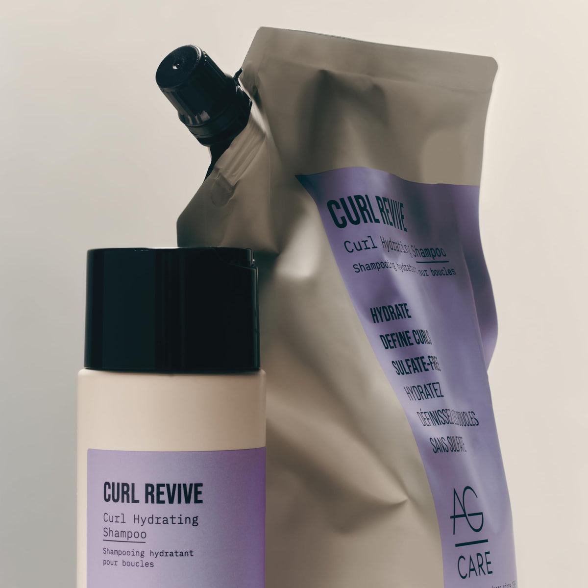 AG Care Curl Revive lifestyle shot on curly hair highlighting defined frizz-free curls