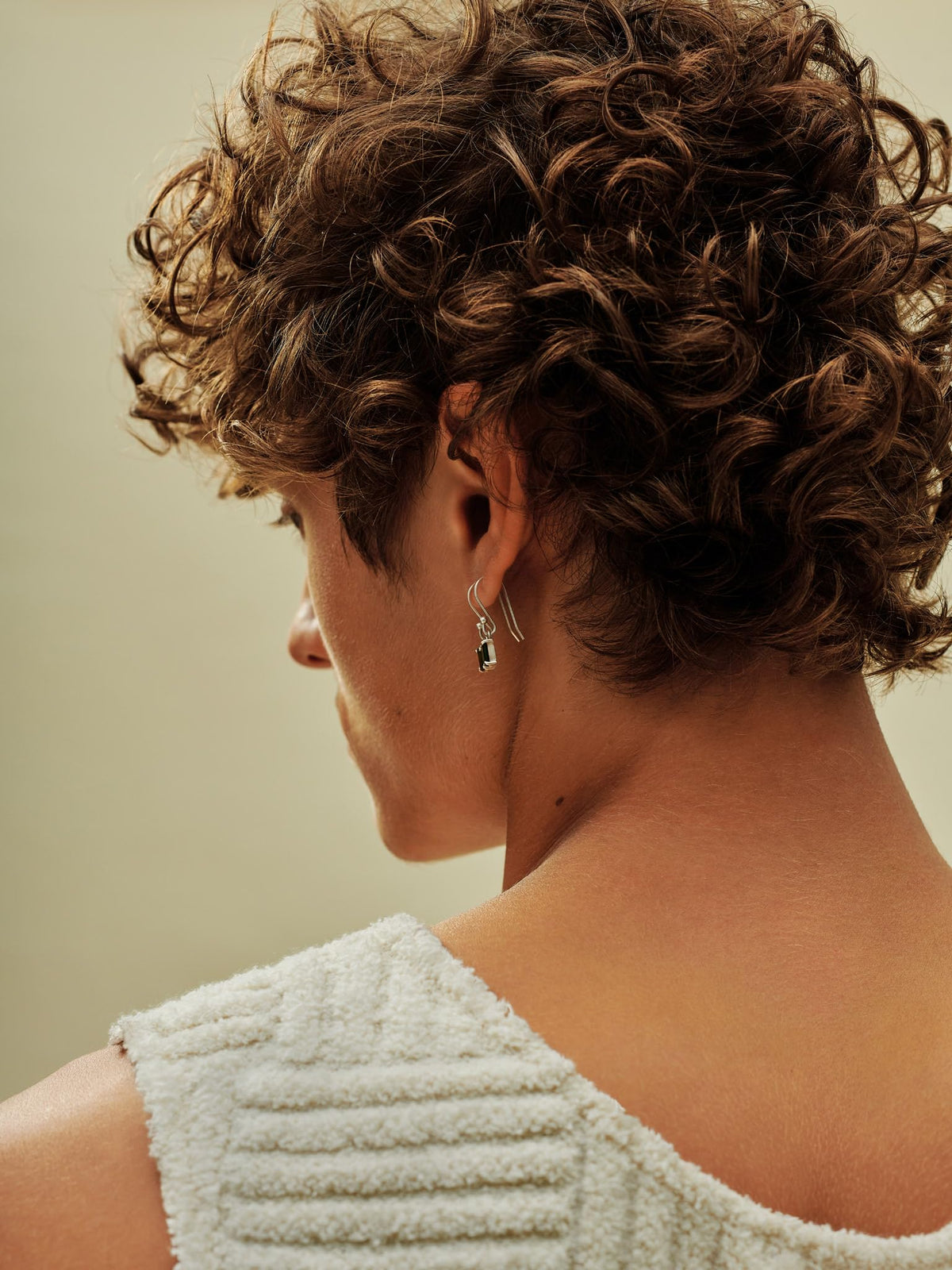 AG Care styled beach curls lifestyle shot highlighting defined, shiny curls