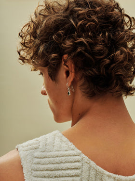 AG Care styled beach curls lifestyle shot highlighting defined, shiny curls
