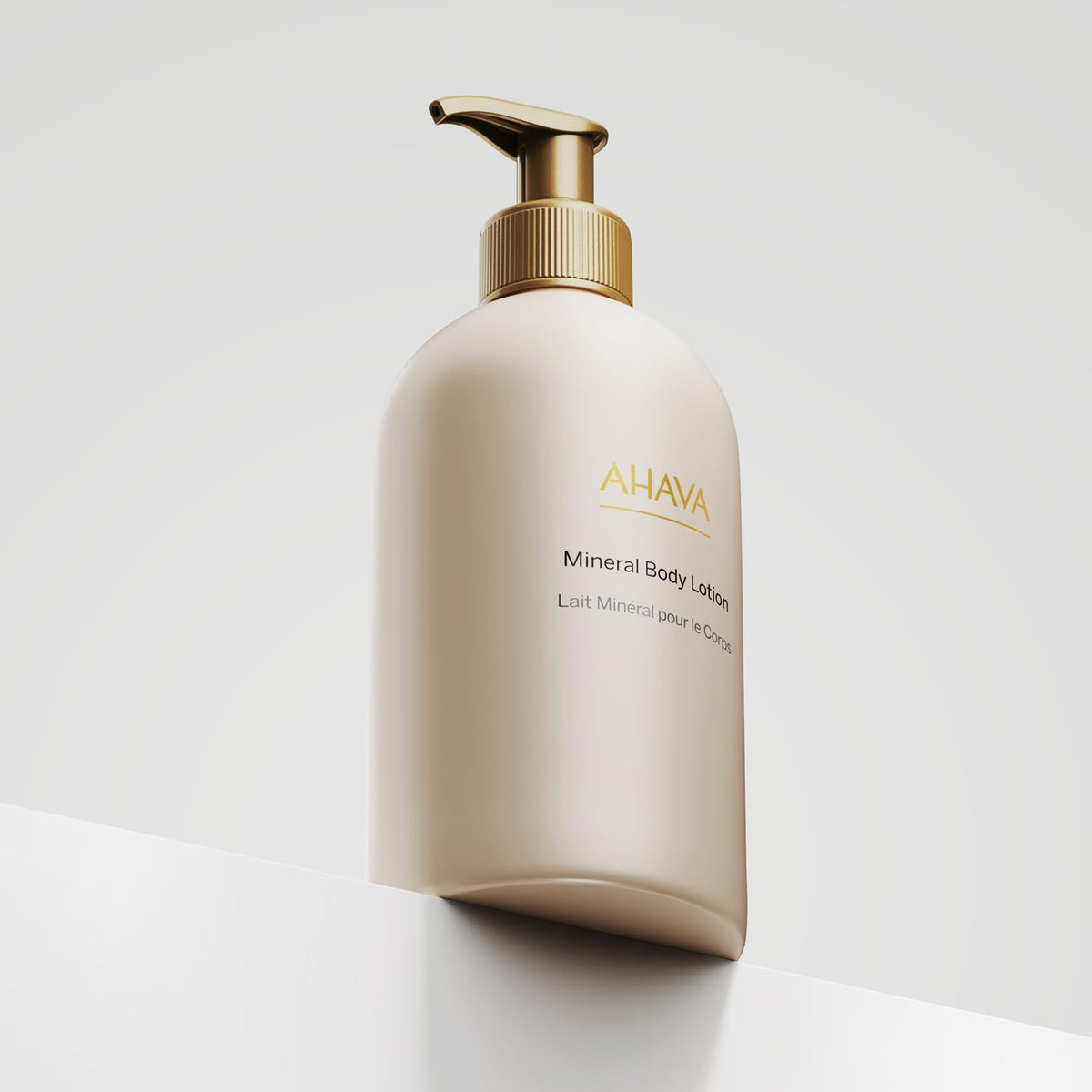 AHAVA 17 fl oz bottle next to everyday items to show convenient size and portability