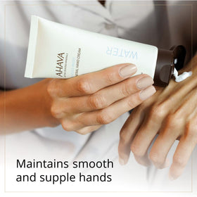 AHAVA hand cream applied to woman's hands, soothes and softens skin benefit