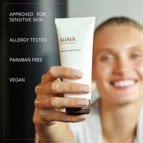 AHAVA hand cream beside ruler showing 3.4 fl oz scale, portable travel-friendly benefit