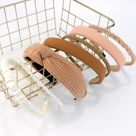 AHONEY headband in hand showing size and lightweight travel benefit