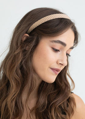 AIBFRID headband on hand for scale showing compact size and lightweight benefit
