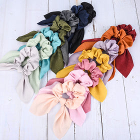 Aileam close-up satin texture of scrunchie highlighting smooth fabric and hair protection