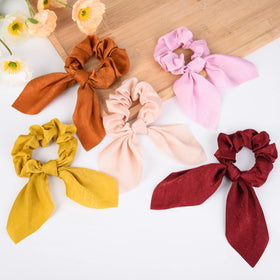 Aileam color array flatlay of 14 scrunchies showing outfit-matching options