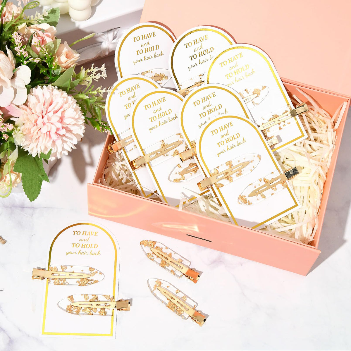 Aileam clips displayed on a wedding table to show coordinated bridal party accessories