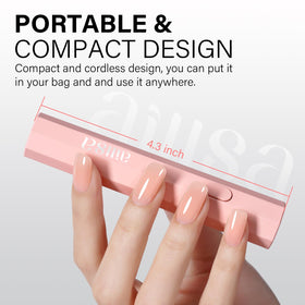 AILLSA beside a hand for scale showing small size and travel-friendly portability