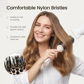 AIMIKE NaturaVol brush in use with blow dryer for smoother, shinier hair